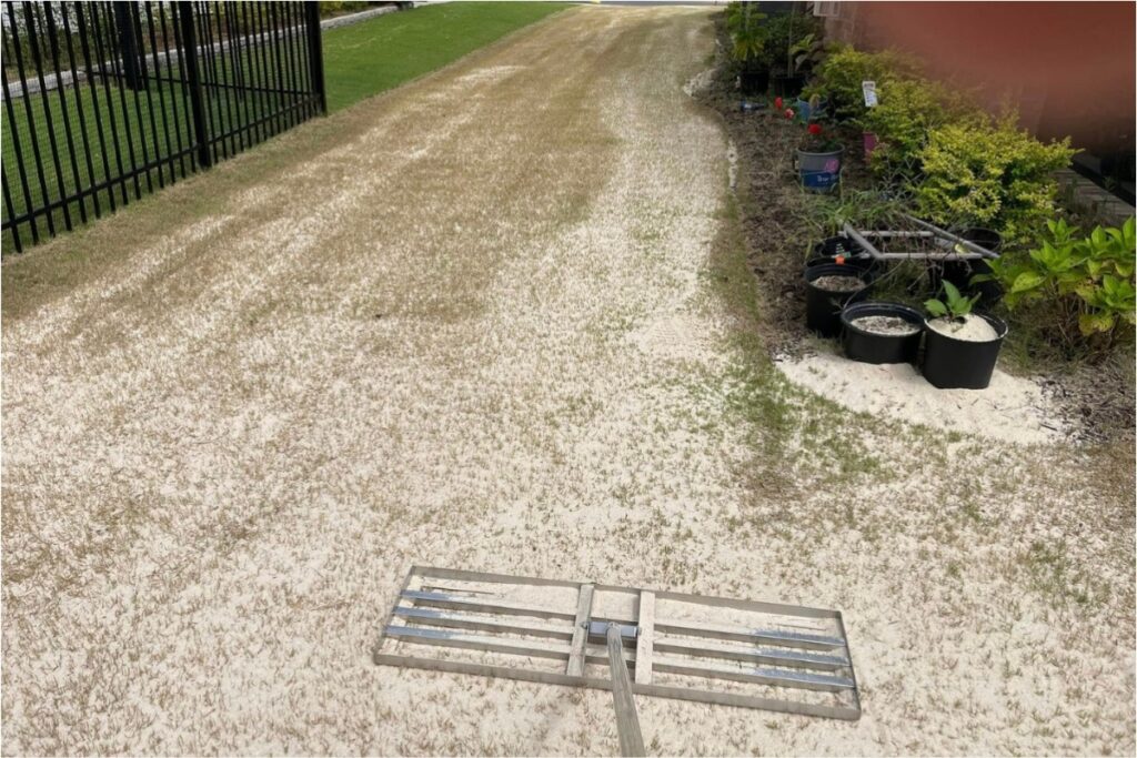 Sand leveling in progress on a lawn to correct uneven turf in Mooresville NC